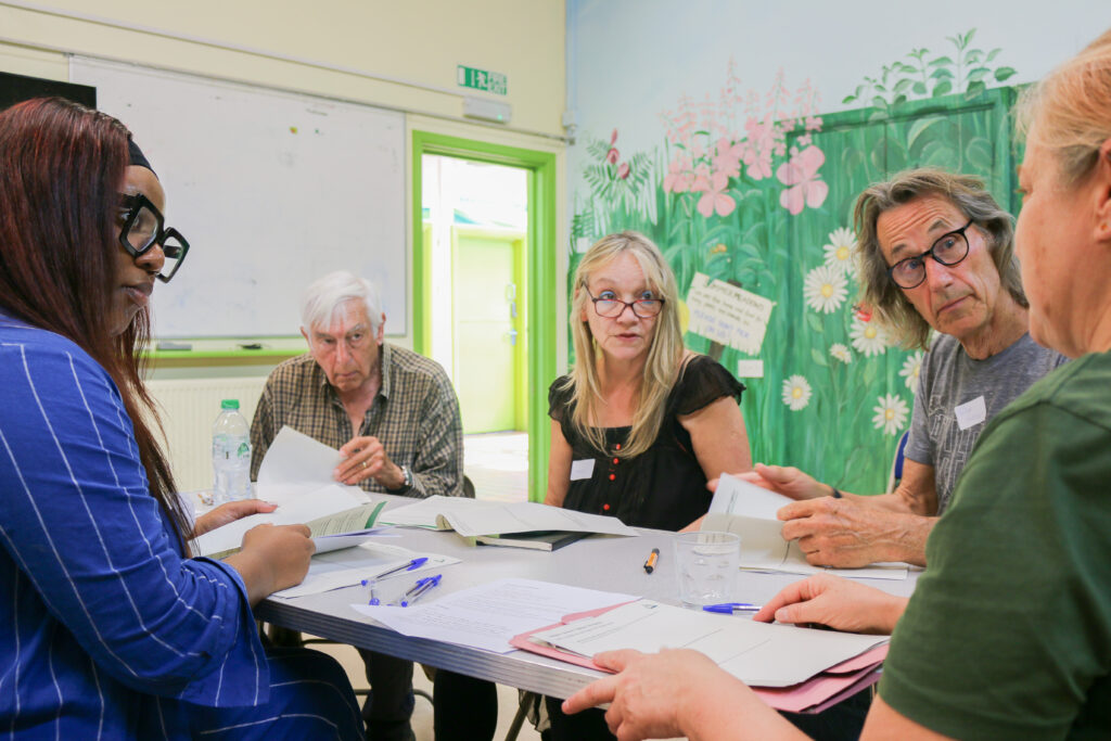 Volunteers discussing ideas around a table